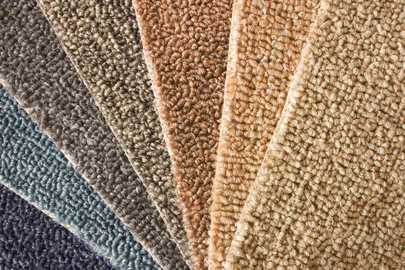 A variety of carpets in different colors for flooring needs.