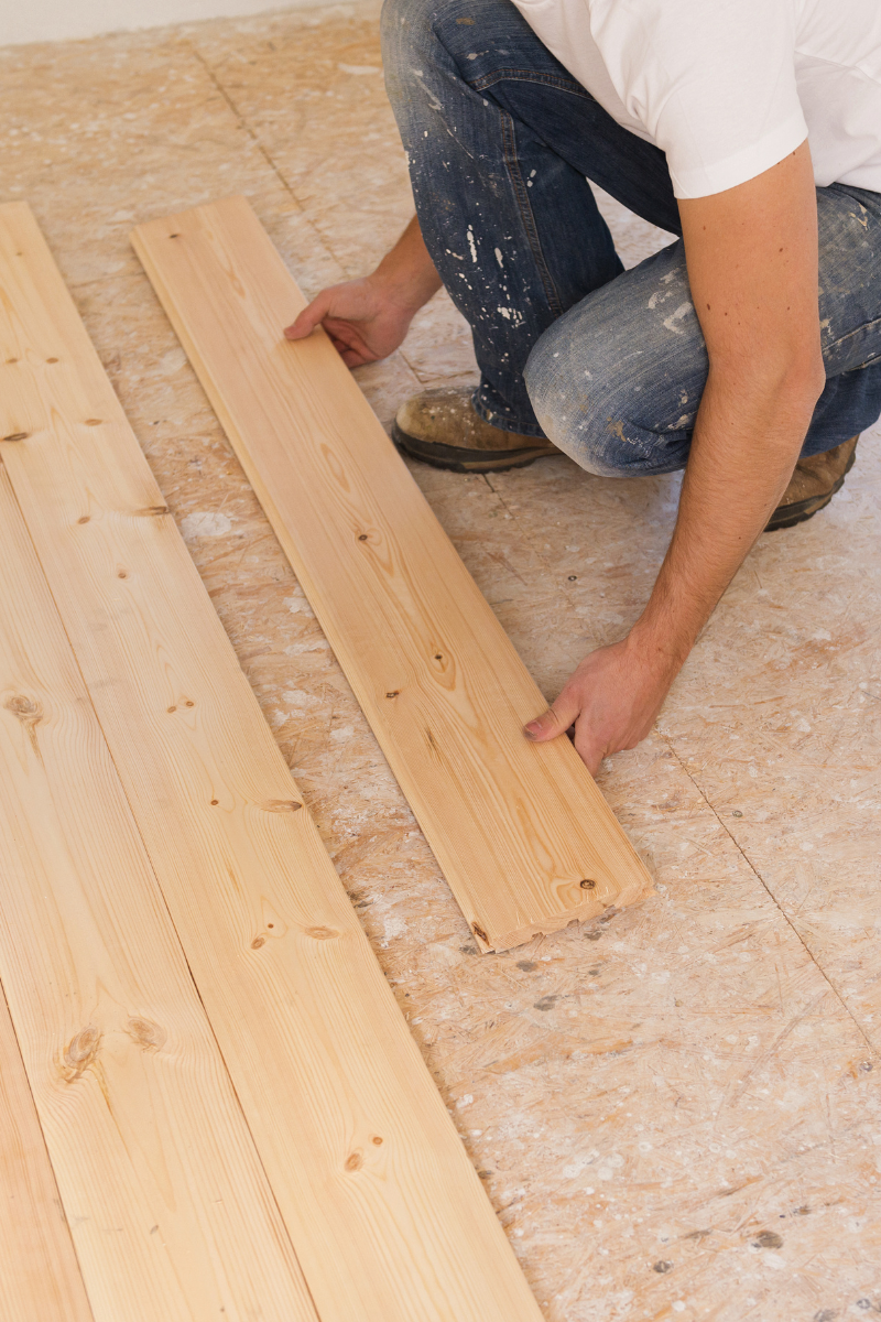 Carrollton Flooring Company 9 Man who works for Carrollton Flooring Company installing hardwood floors.