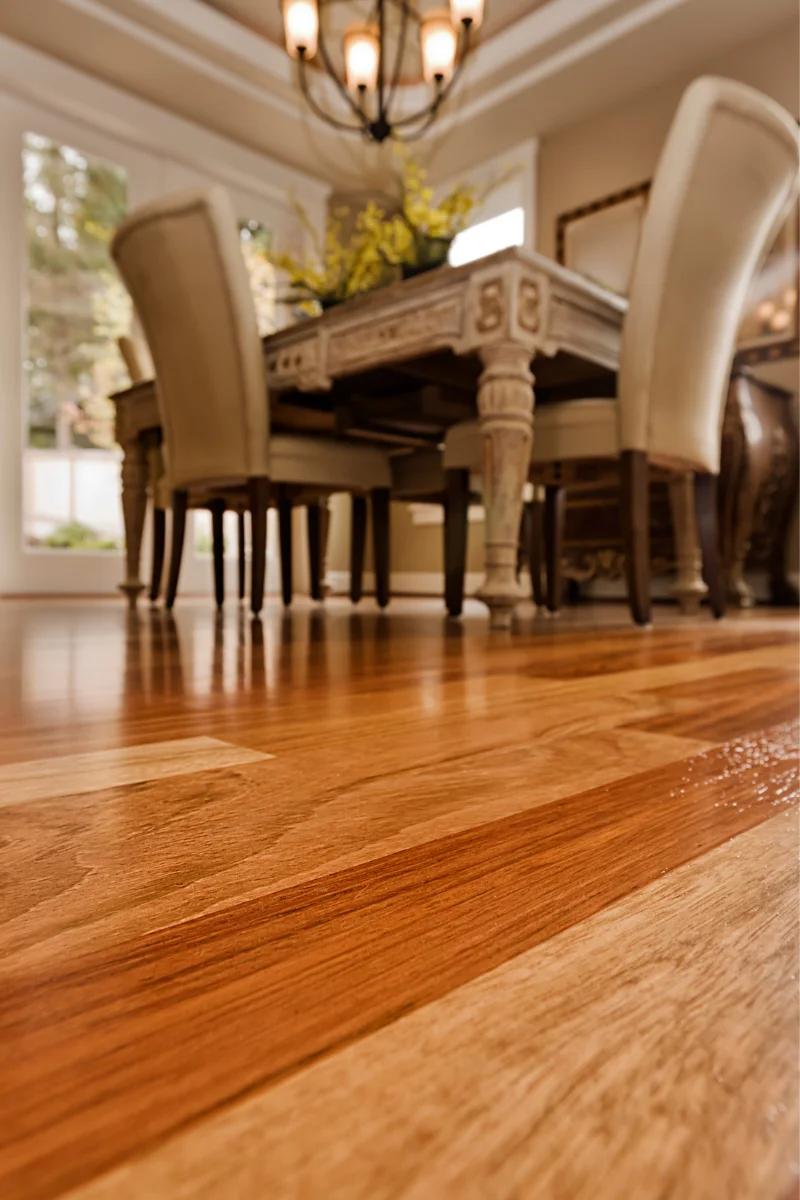 A room with Chamblee Flooring Company's hardwood floors and a dining table.