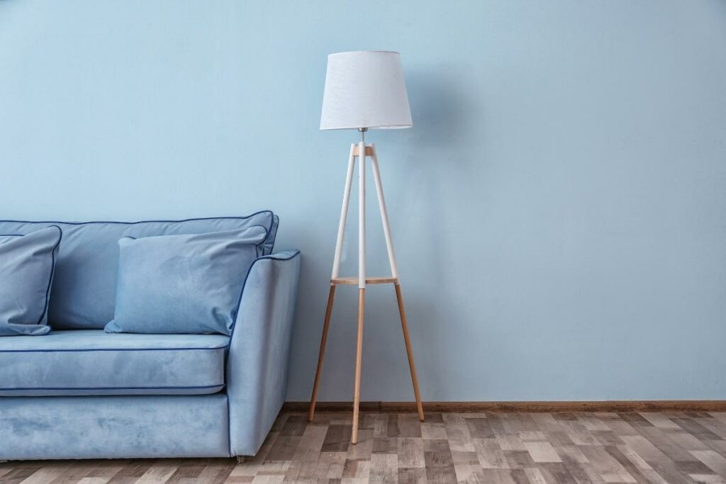 Creating Harmony: Unveiling the Perfect Furniture and Floor Color Combinations 4 A blue couch in front of a ______ wall.