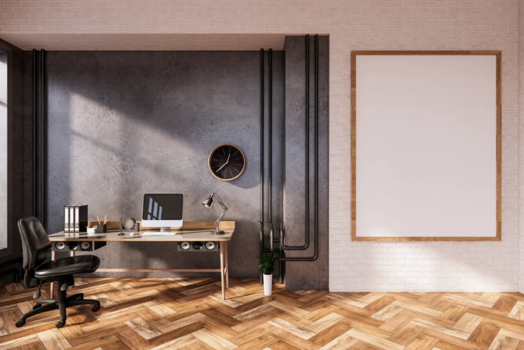 How To Choose The Perfect Hardwood Floor Stain 1 An office with a hardwood floor and a poster on the wall.
