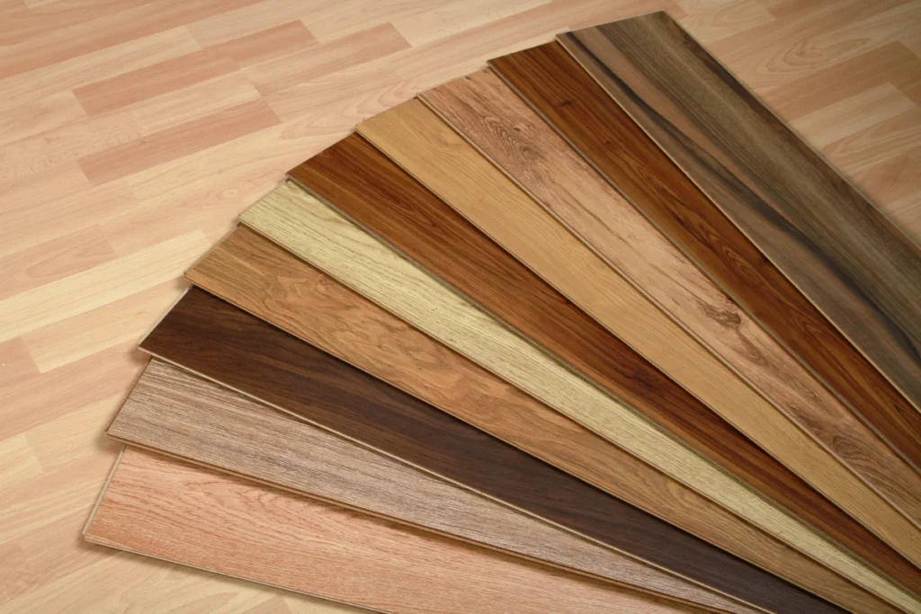 How To Choose The Perfect Hardwood Floor Stain 2 A variety of hardwood flooring options on a stained wooden floor.