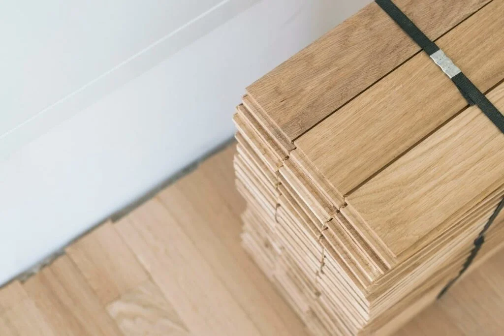 Installing hardwood flooring.