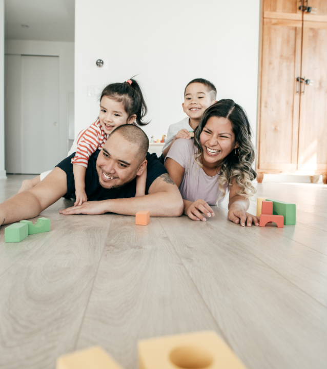A family building with blocks in their new Alpharetta home. A family building with blocks in their new Alpharetta home.