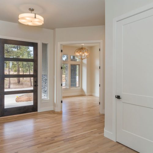 A hallway with hardwood floors.
