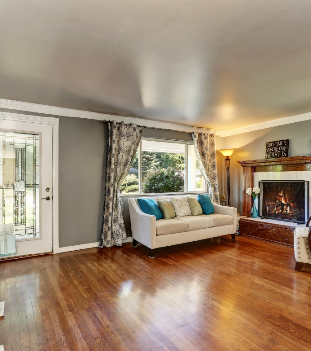 A living room with hardwood floors provided by Kennesaw Flooring Company.