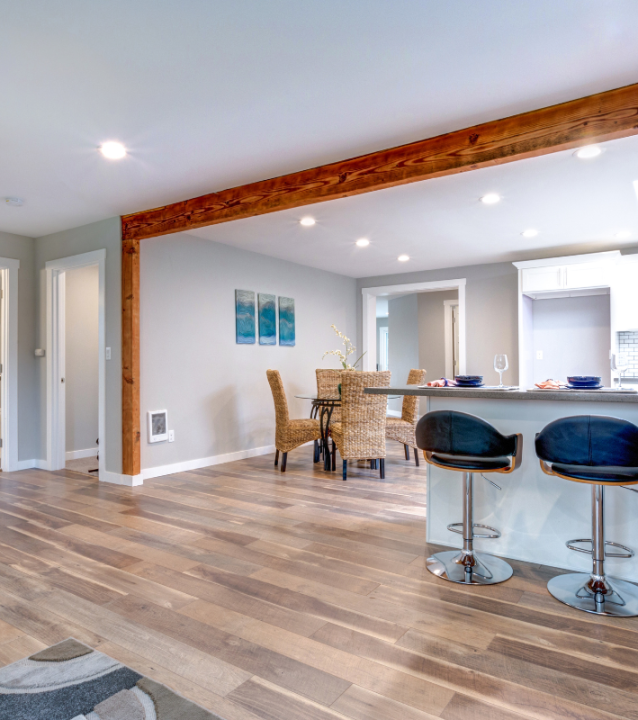 A kitchen with Lawrenceville Flooring Company's exquisite hardwood floors.
