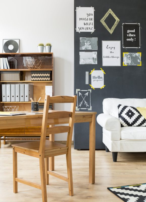 A white couch in a living room with vinyl flooring. A white couch in a living room with vinyl flooring.